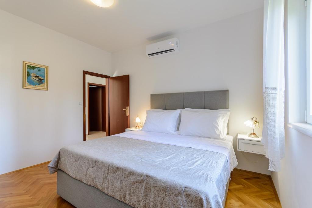 Postel nebo postele na pokoji v ubytování Apartment Marcela