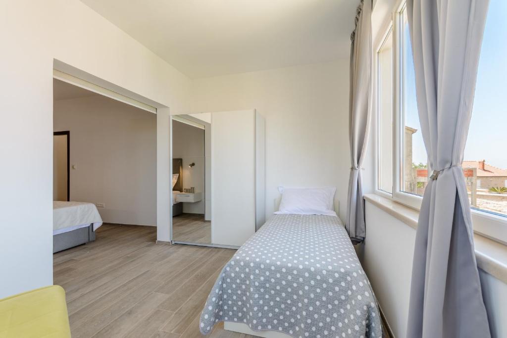 Postel nebo postele na pokoji v ubytování Apartment Marcela