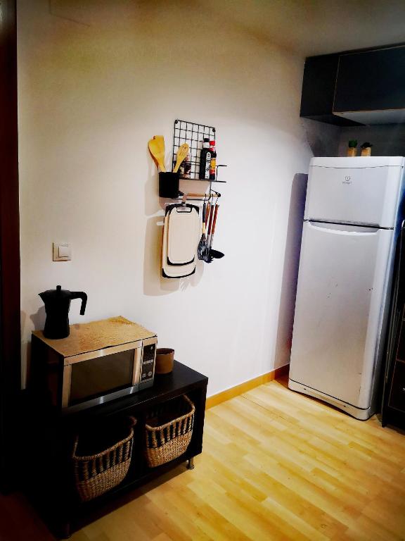 Kuchyňa alebo kuchynka v ubytovaní Cornu Karma Apartment Siuranella