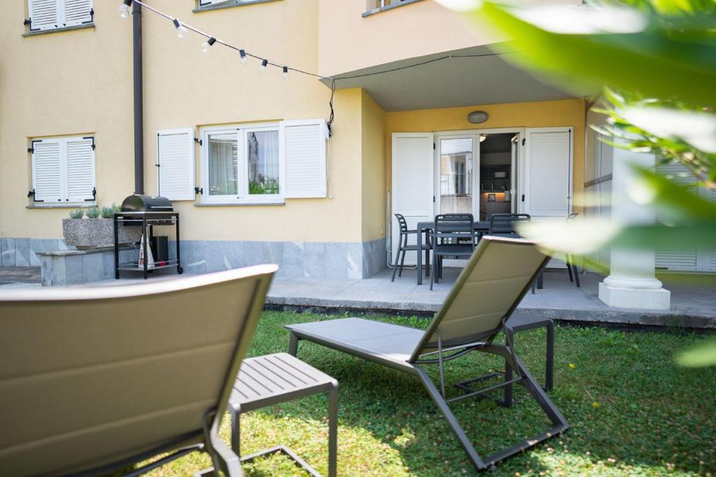 a patio with two chairs and a table at Ponent 602 in Marina Portorož by Locap Group in Portorož