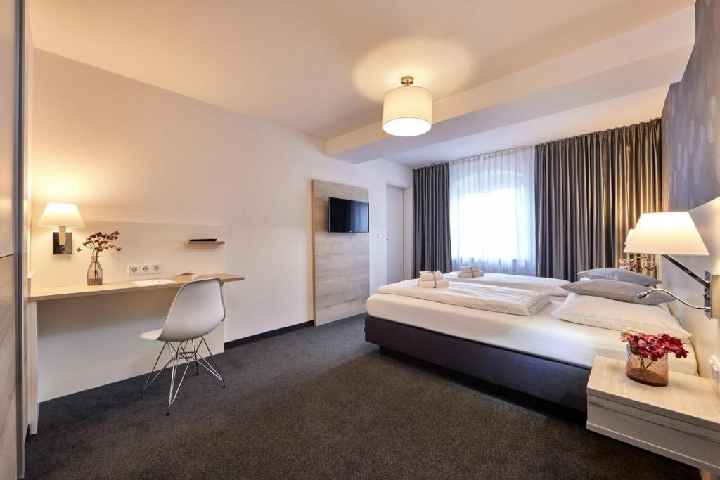 Postel nebo postele na pokoji v ubytování Hotel Alter Wirth