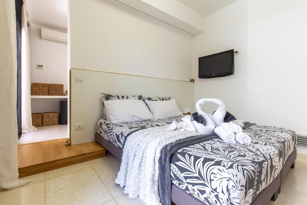 Postel nebo postele na pokoji v ubytování Residenze Longhi