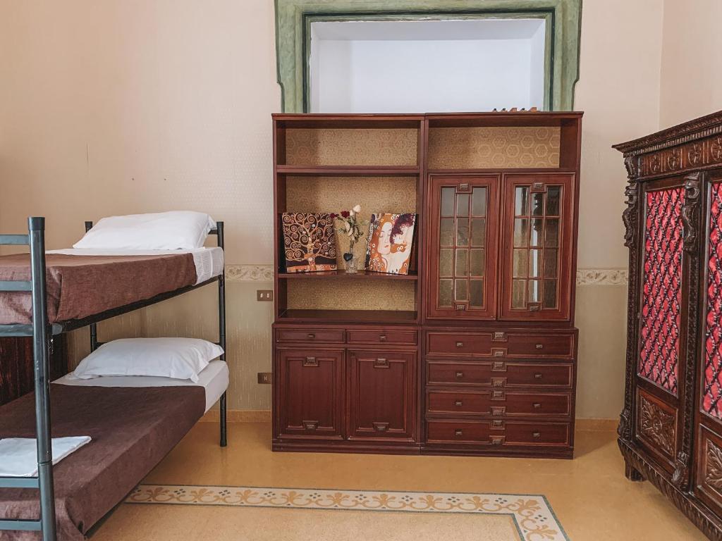 Postel nebo postele na pokoji v ubytování Salerno Experience Hostel