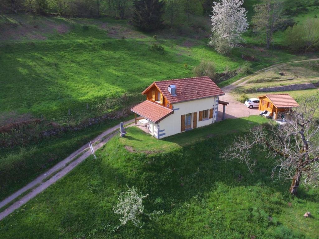 a small house on a hill with a green field at Gîte Saulxures-sur-Moselotte, 3 pièces, 4 personnes - FR-1-589-281 in Saulxures-sur-Moselotte