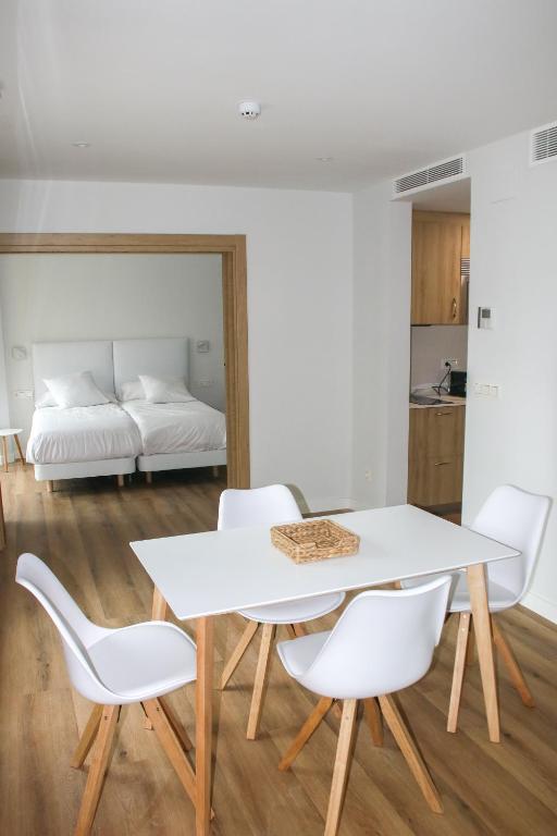 A bed or beds in a room at Apartamentos Mundaka Surf Camp