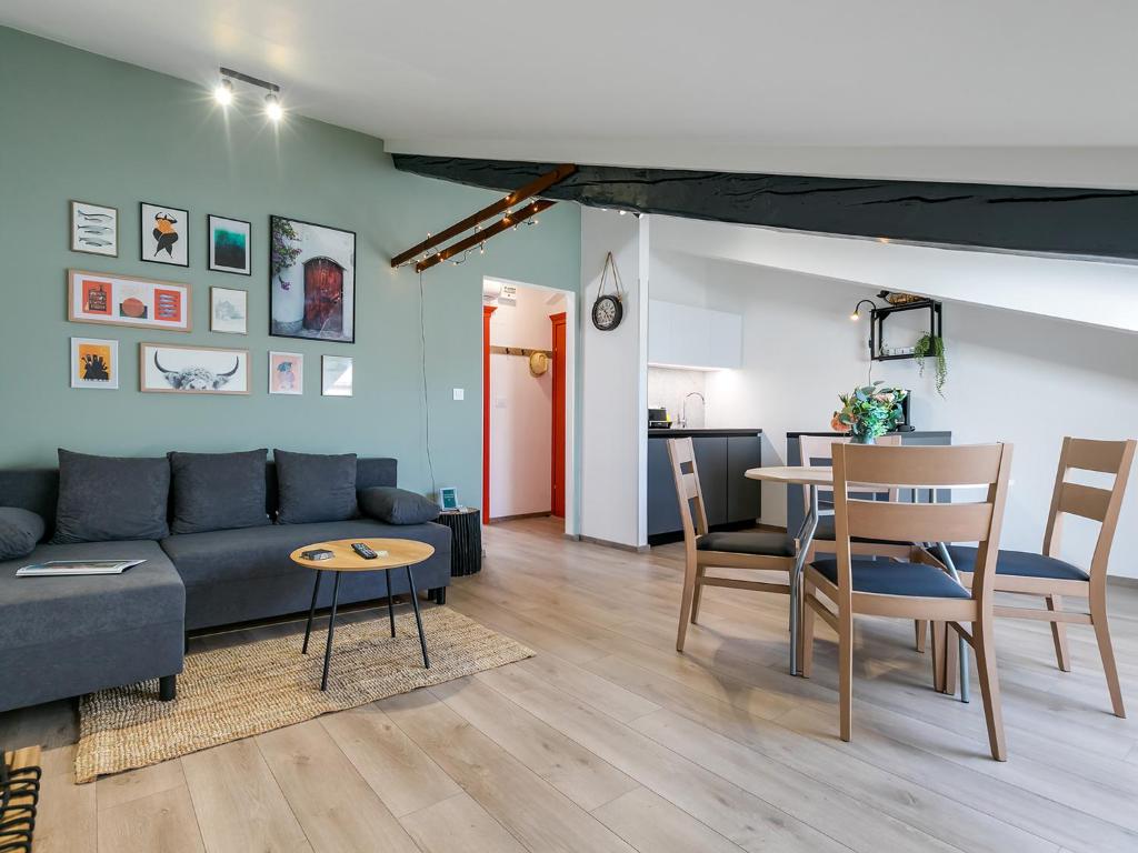 a living room with a couch and a table at FantAttic apartment city center in Poreč