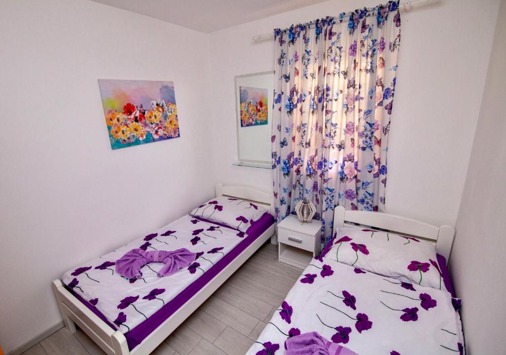 Postel nebo postele na pokoji v ubytování Villa Anita