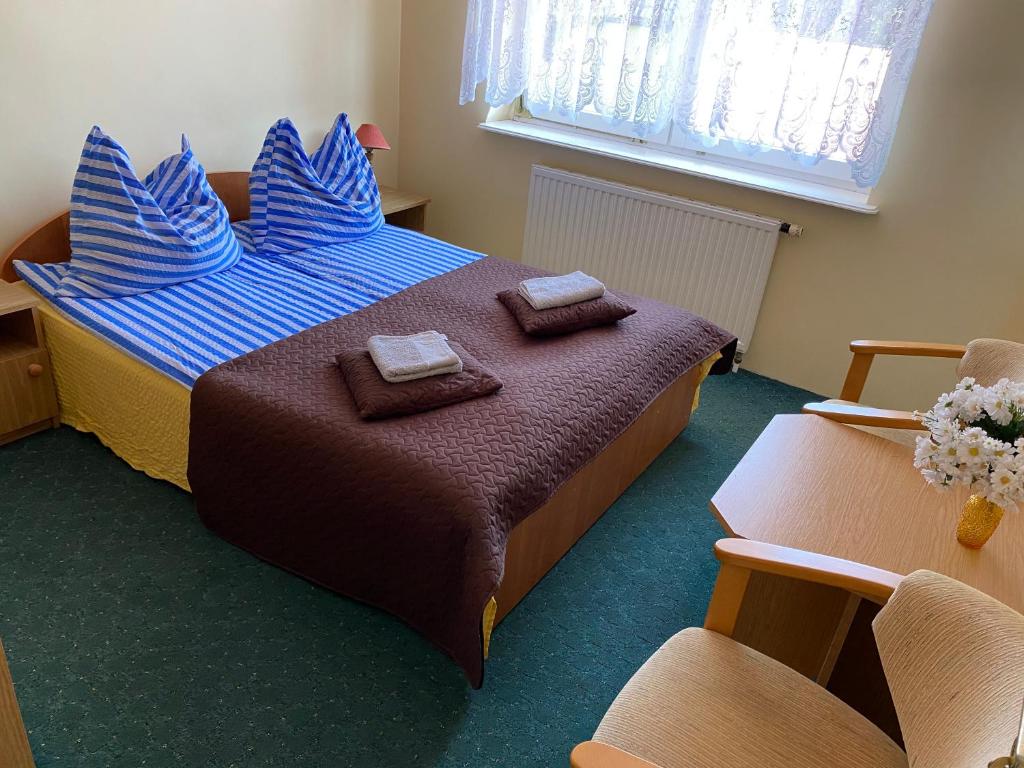 Postel nebo postele na pokoji v ubytování Pokoje Gościnne Białek