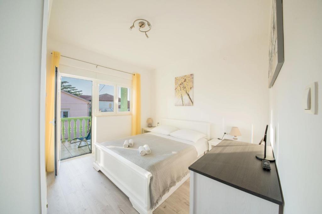 Łóżko lub łóżka w pokoju w obiekcie Apartment Prominac