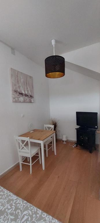 Televízia a/alebo spoločenská miestnosť v ubytovaní Studio Allure 1