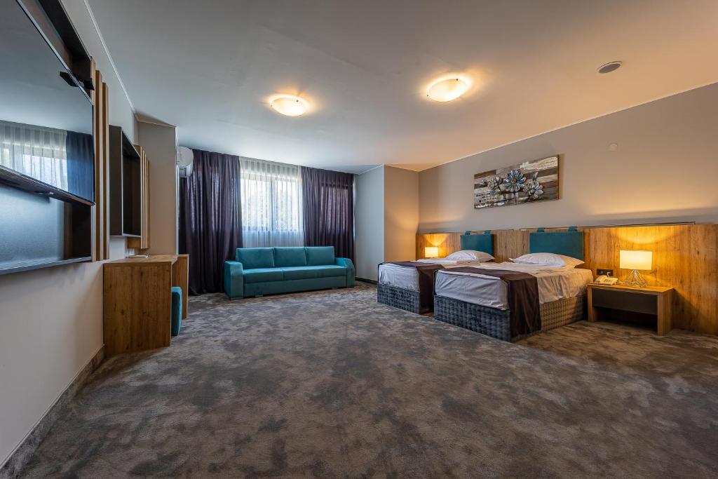 Postel nebo postele na pokoji v ubytování Hotel Caesar 2