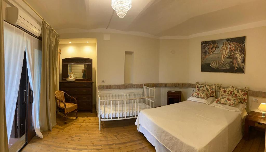 Postel nebo postele na pokoji v ubytování Al Riccio