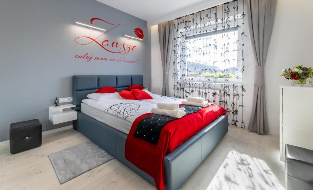 Posteľ alebo postele v izbe v ubytovaní Leo Apartament Delux