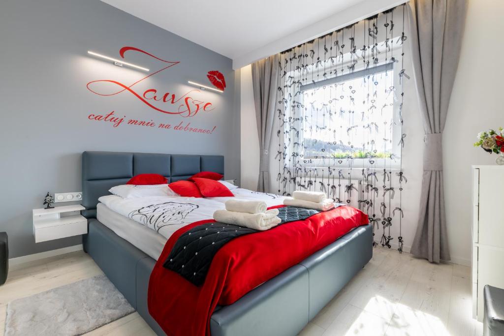 Posteľ alebo postele v izbe v ubytovaní Leo Apartament Delux