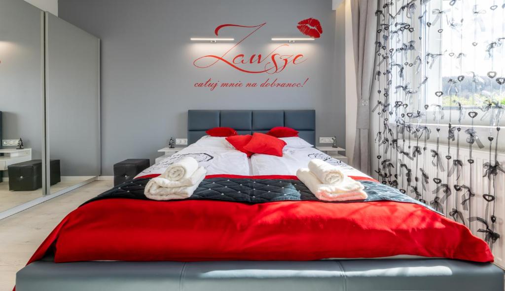 Posteľ alebo postele v izbe v ubytovaní Leo Apartament Delux