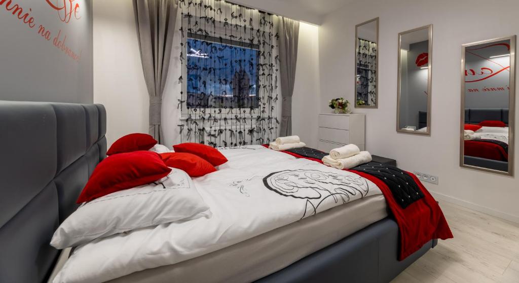 Posteľ alebo postele v izbe v ubytovaní Leo Apartament Delux