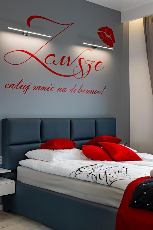 Posteľ alebo postele v izbe v ubytovaní Leo Apartament Delux