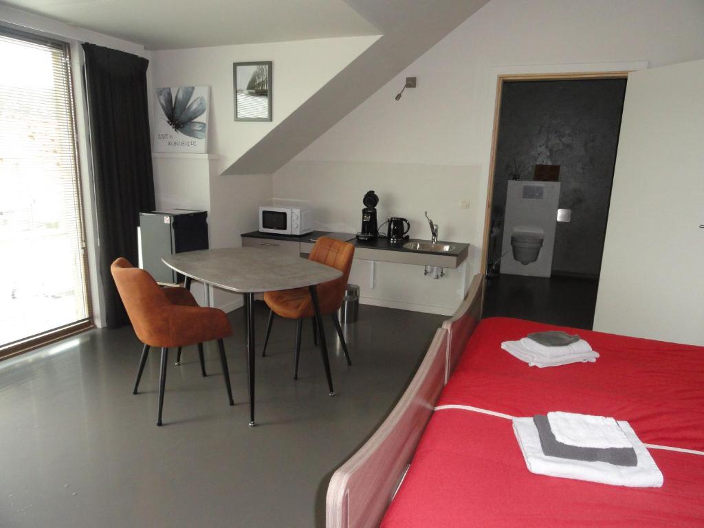 Postel nebo postele na pokoji v ubytování B&B Altijd Genieten