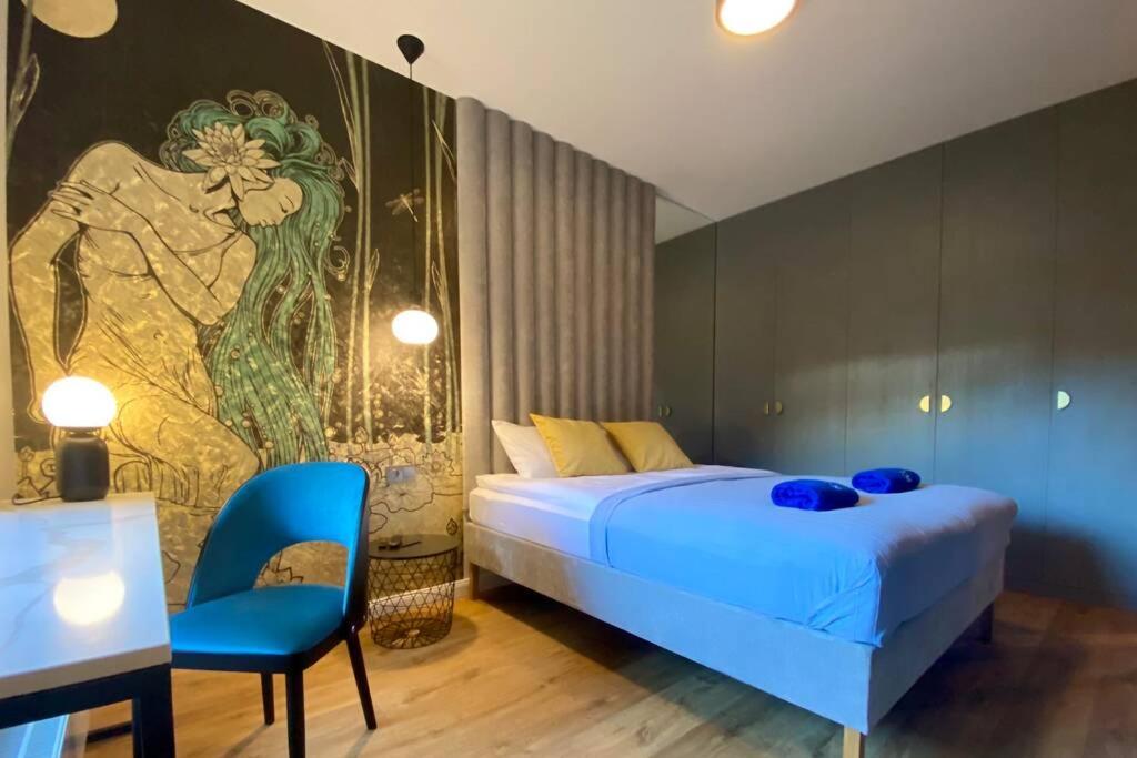 Posteľ alebo postele v izbe v ubytovaní Apartamenty Portova Q4Apartments