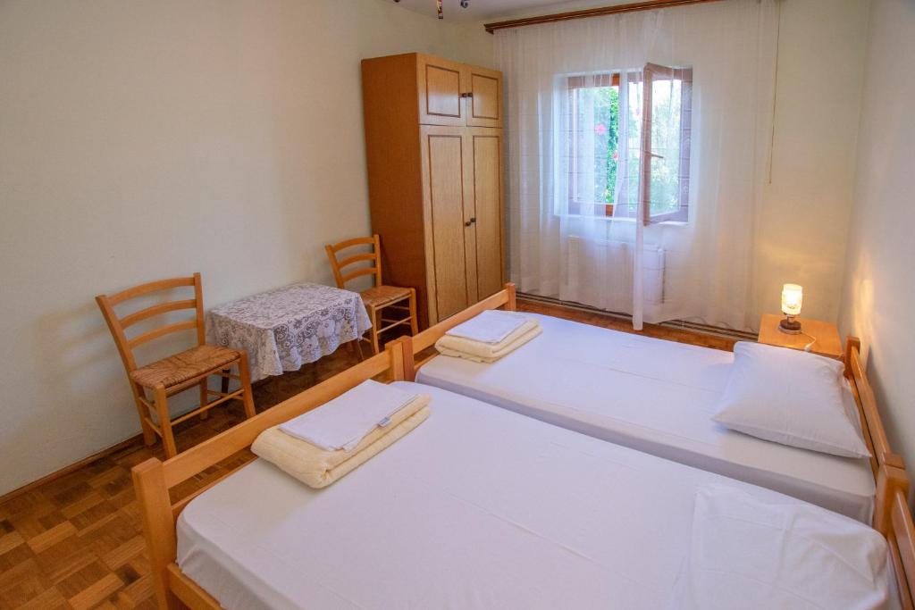 Postel nebo postele na pokoji v ubytování Apartments Immortelle