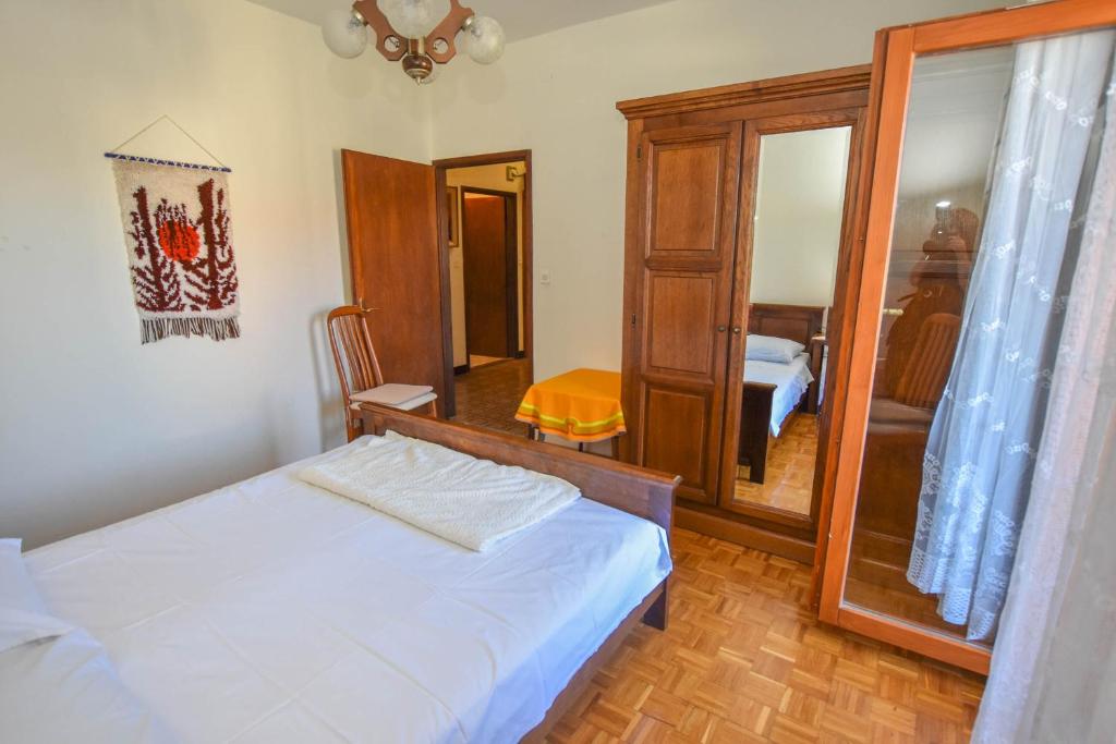 Postel nebo postele na pokoji v ubytování Apartments Immortelle