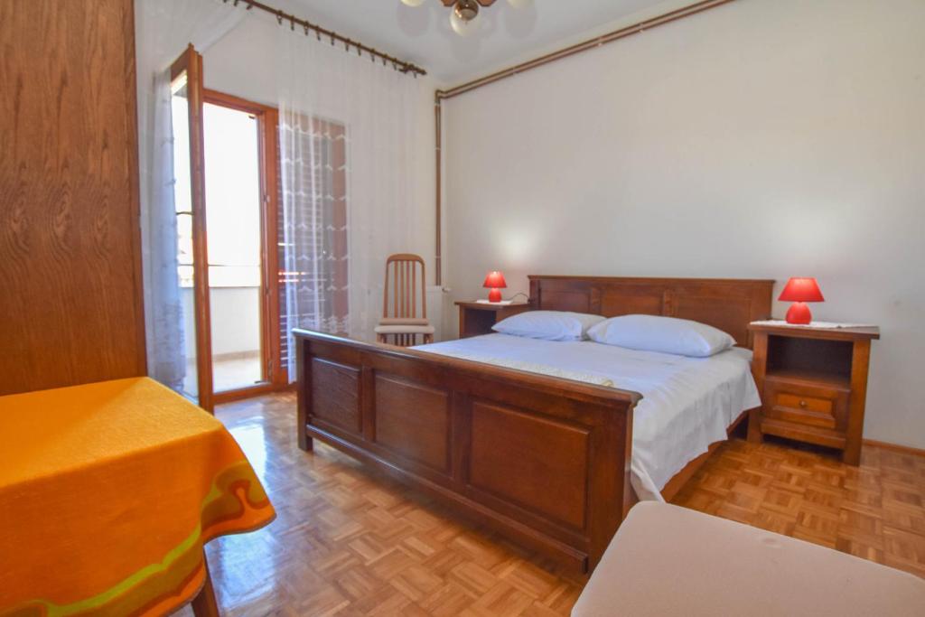 Postel nebo postele na pokoji v ubytování Apartments Immortelle