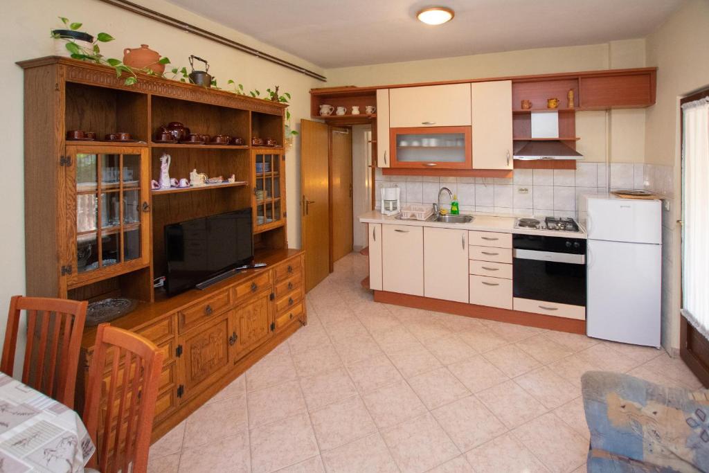 Kuchyň nebo kuchyňský kout v ubytování Apartments Immortelle