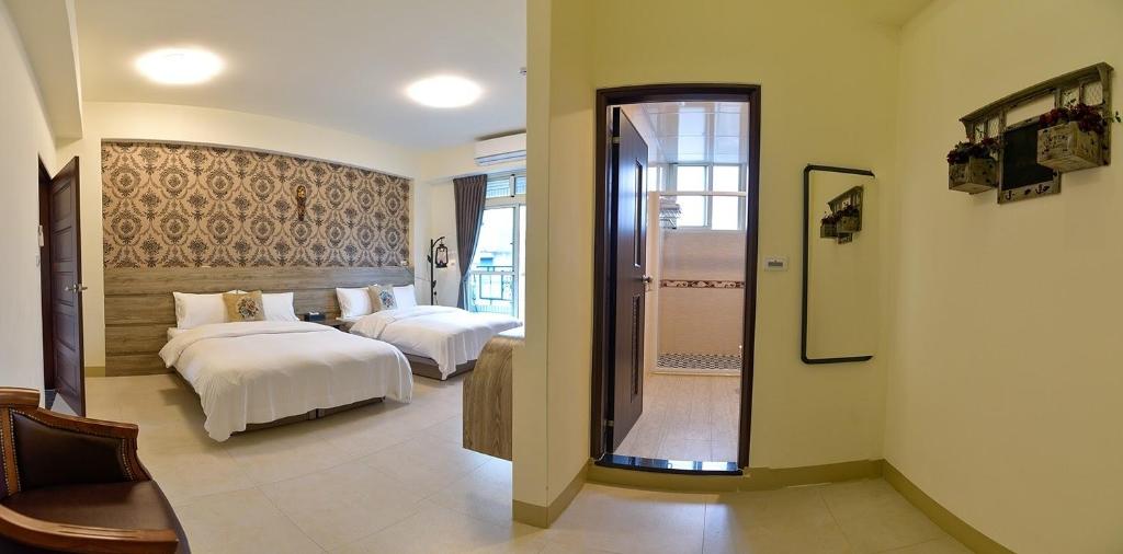 Postel nebo postele na pokoji v ubytování Ruisui Style B&B