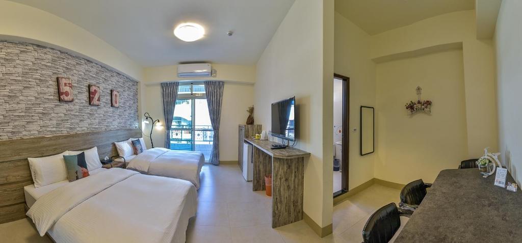 Postel nebo postele na pokoji v ubytování Ruisui Style B&B