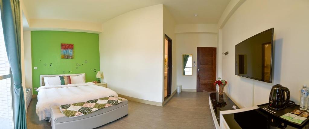 Postel nebo postele na pokoji v ubytování Ruisui Style B&B