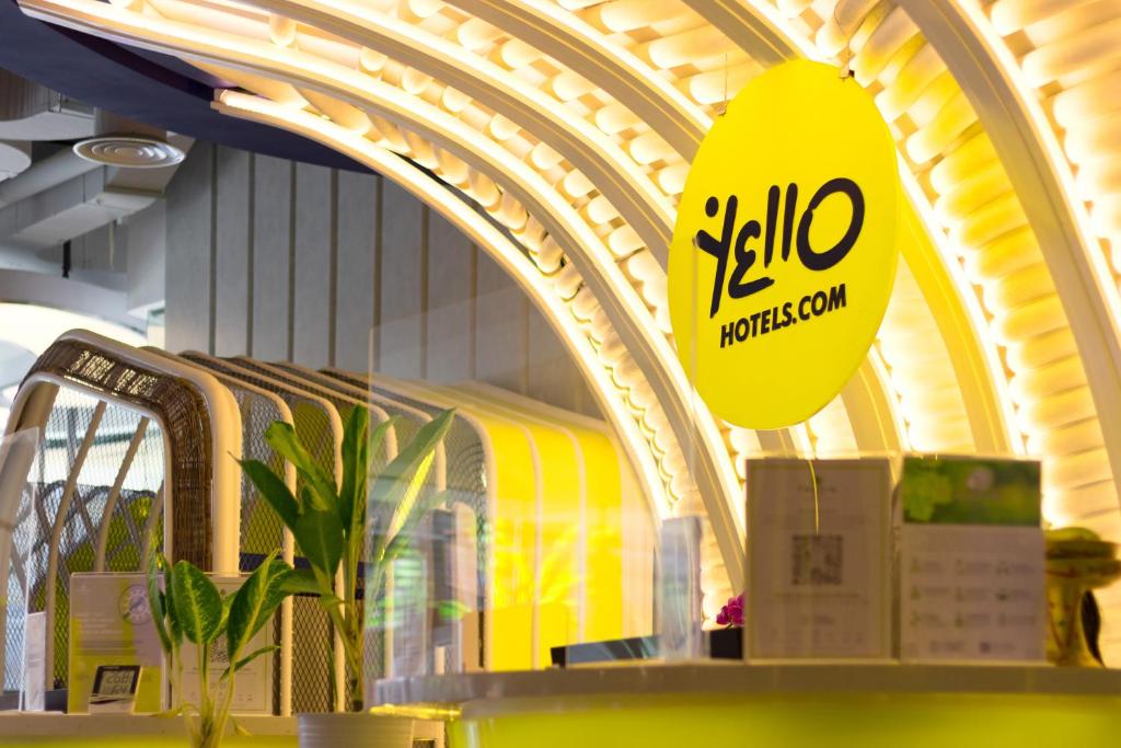 a store with a yellow sign in a building at YELLO Hotel Kuta Beachwalk Bali in Kuta
