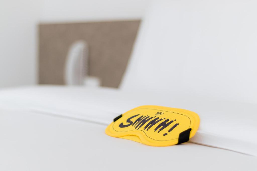 a yellow brush sitting on a counter next to a sink at YELLO Hotel Kuta Beachwalk Bali in Kuta