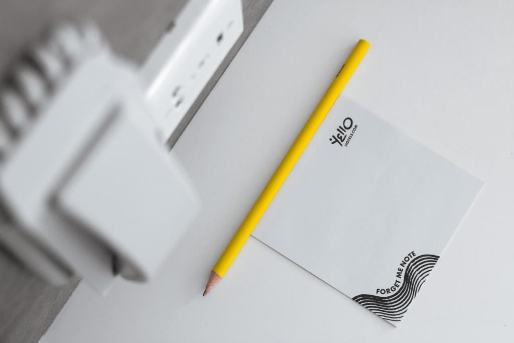 a pencil sitting on top of a piece of paper at YELLO Hotel Kuta Beachwalk Bali in Kuta