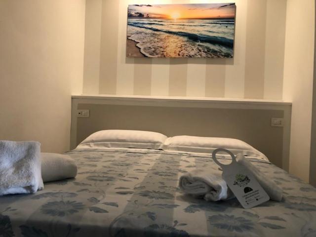 Postel nebo postele na pokoji v ubytování Hotel La Rosetta Scauri