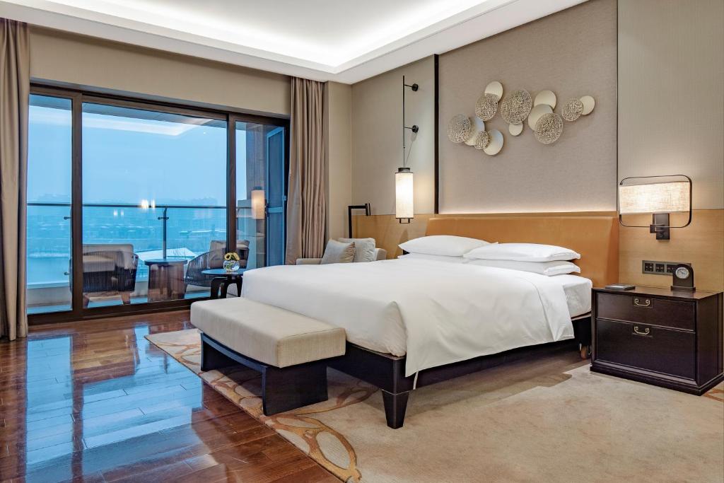 Postel nebo postele na pokoji v ubytování Hyatt Regency Xi'an