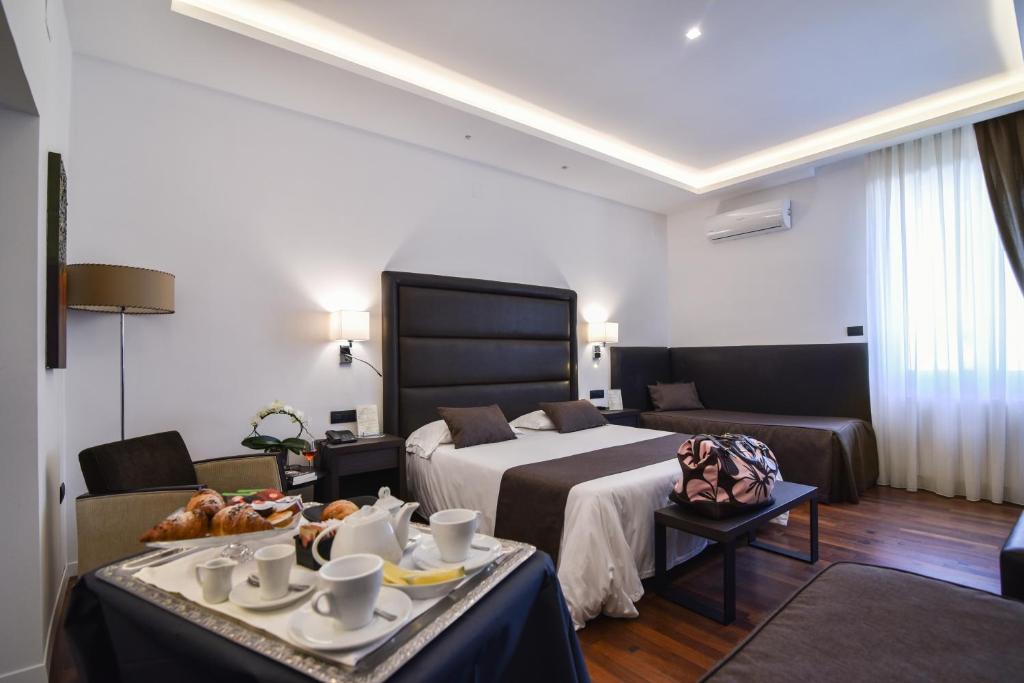 Postel nebo postele na pokoji v ubytování Hotel Palma