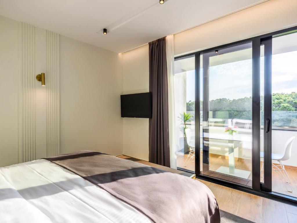 Postel nebo postele na pokoji v ubytování Mövenpick Hotel Lalez Durres