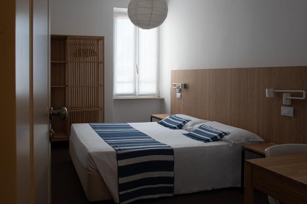 Postel nebo postele na pokoji v ubytování Albergo alla Spiaggia