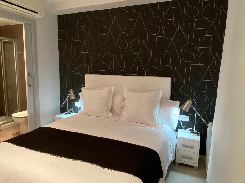 Posteľ alebo postele v izbe v ubytovaní Hostal Somnis