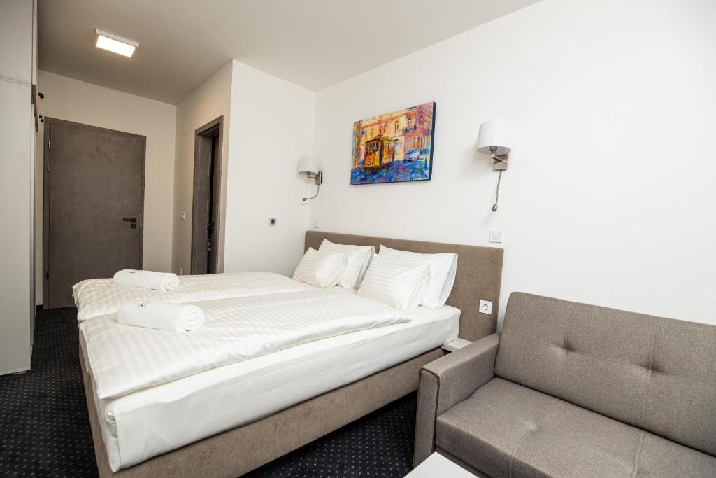 Postel nebo postele na pokoji v ubytování Arena Deluxe & Spa