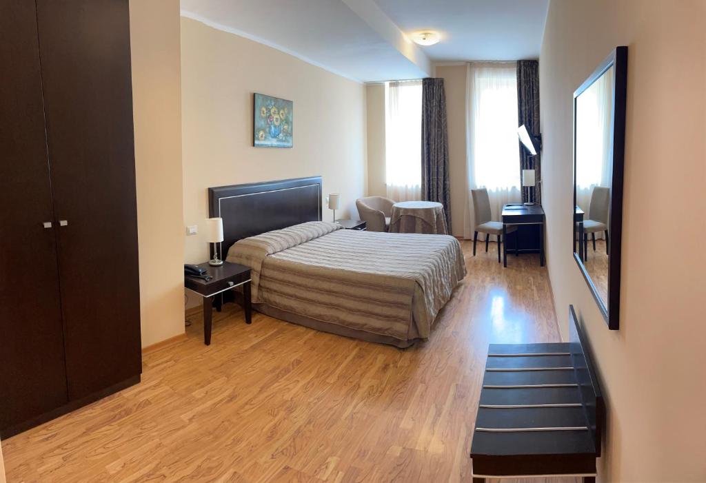 Postel nebo postele na pokoji v ubytování Hotel Villa Cinzia