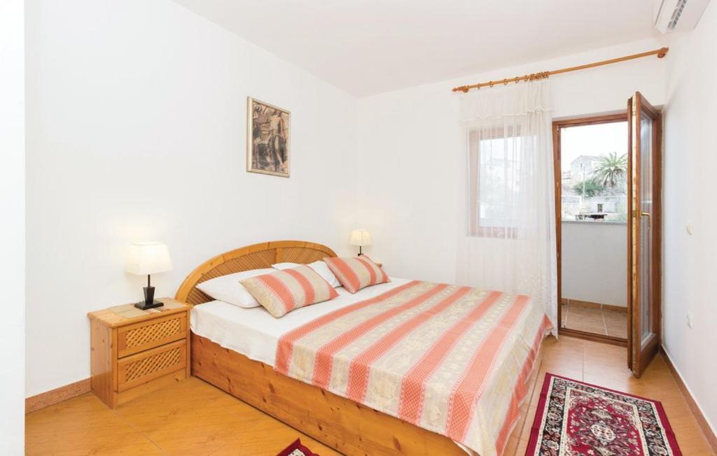 Łóżko lub łóżka w pokoju w obiekcie Apartmani Čižmešija