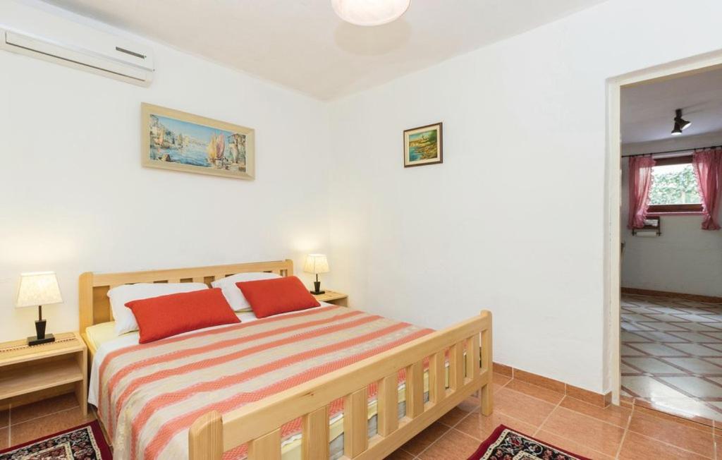 Łóżko lub łóżka w pokoju w obiekcie Apartmani Čižmešija