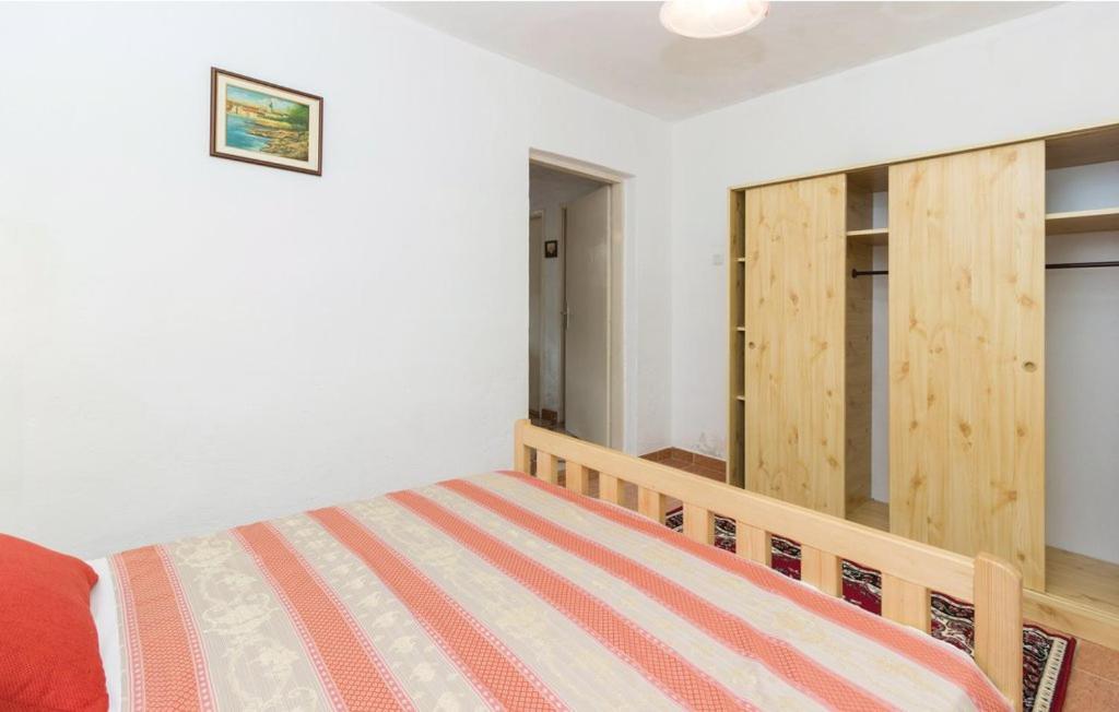 Łóżko lub łóżka w pokoju w obiekcie Apartmani Čižmešija