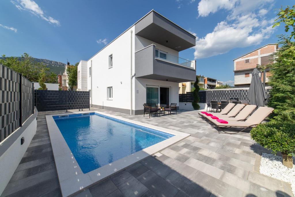 The swimming pool at or close to New luxury modern four-bedroom villa with pool