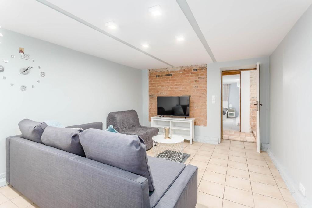 Televízia a/alebo spoločenská miestnosť v ubytovaní Chill Apartments Gersona