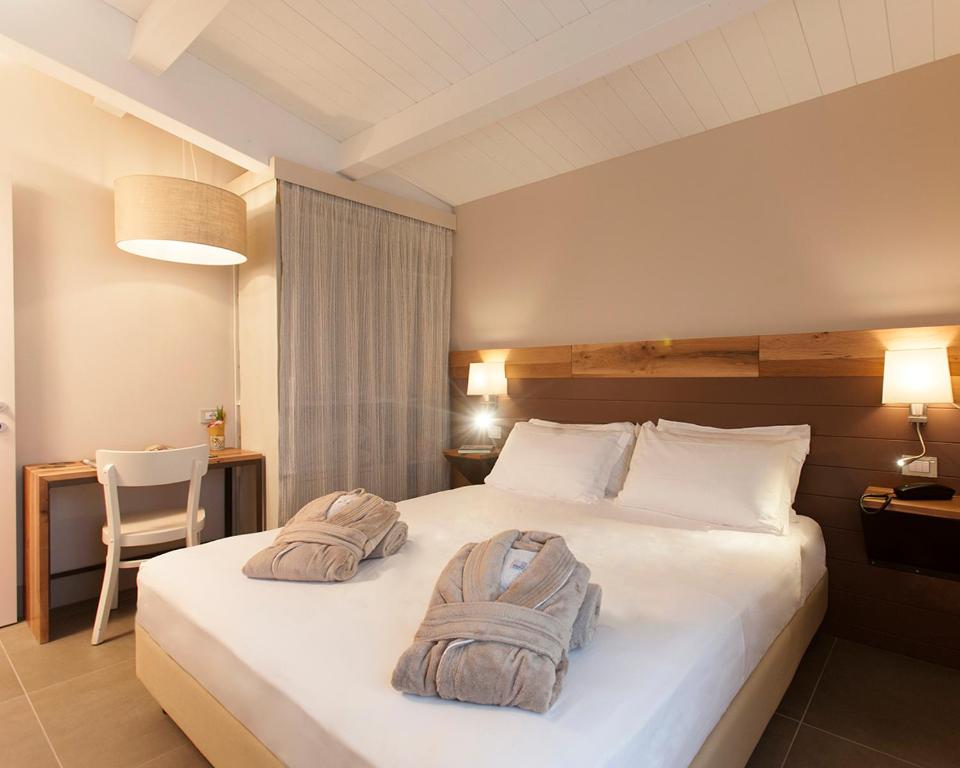 Posteľ alebo postele v izbe v ubytovaní Podere Maremma Spa & Ristorante