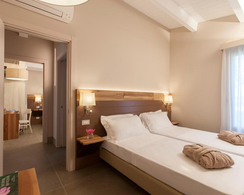 Posteľ alebo postele v izbe v ubytovaní Podere Maremma Spa & Ristorante