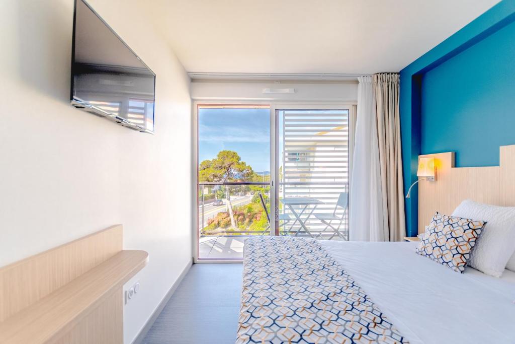 Postel nebo postele na pokoji v ubytování Hotel Le Virevent