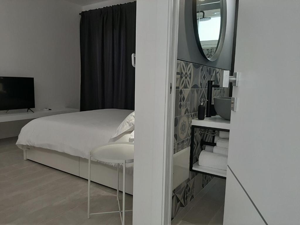 Łóżko lub łóżka w pokoju w obiekcie Kore Home